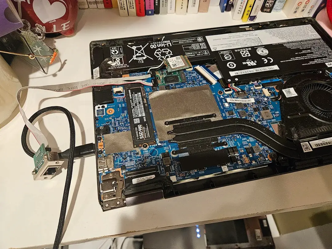 Internal components of laptop after replacing the Wi-Fi card with ethernet card.